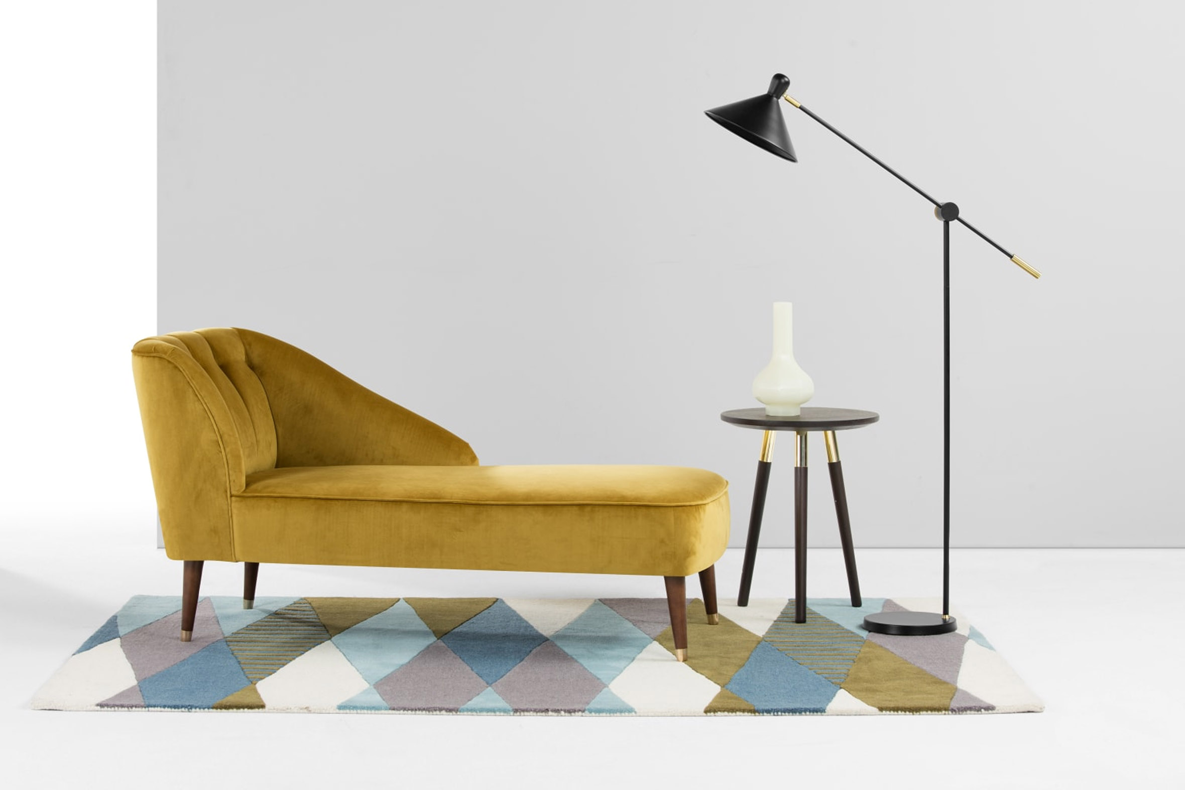 Contemporary living room with metallic side table and potted greenery